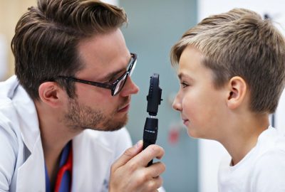 child-optometry-male-optometrist-optician-doctor-examines-eyesight-of-little-boy.jpg